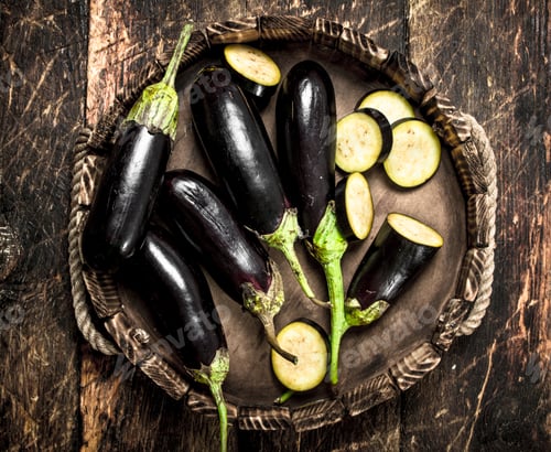 Preview: Eggplants in an old wooden tray.