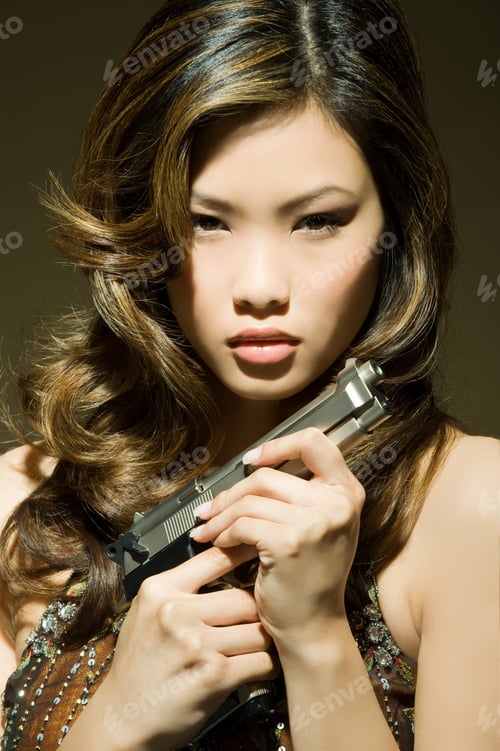 Preview: A woman holding a gun