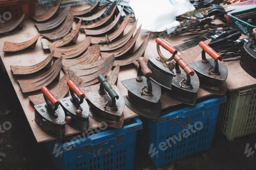 Preview: A local shop in market selling an old steel coal irons