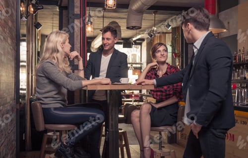 Preview: Four People Talking, Standing Sitting, Small Group Of People Talking, Coffee Shop Indoors, Men