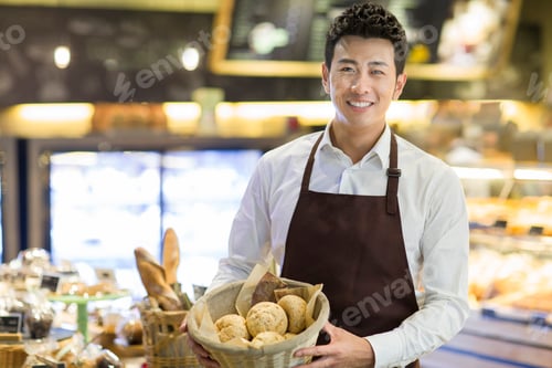 Preview: Young man working in bakery
