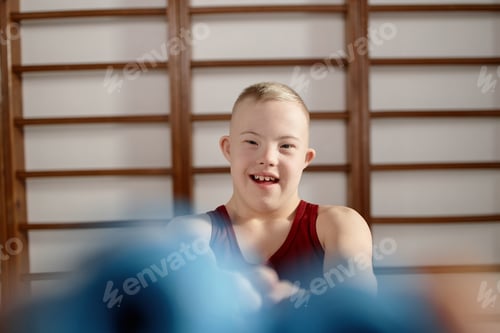 Preview: Portrait of Boy with Down Syndrome Smiling during Physical Activity
