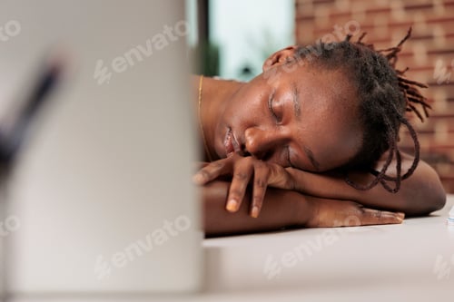 Preview: Stressed remote worker sleeping on table during day