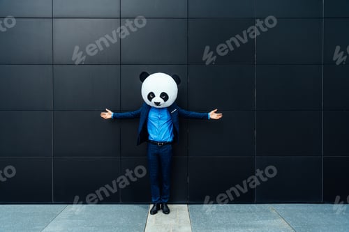 Preview: Storytelling image of a business man wearing a giant panda head