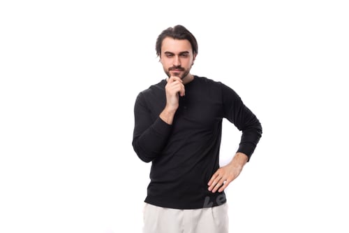 Preview: close-up of a young well-groomed brunette man with a haircut and a beard dressed in a black jacket