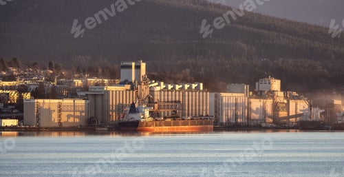 Preview: Industrial Sites in Vancouver Harbour with Mountains in Background.