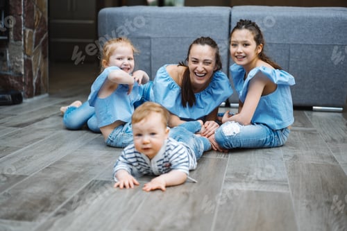 Preview: Mom, two daughters and a little son on the floor