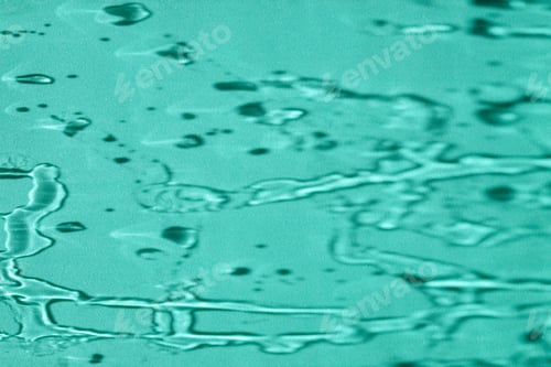 Preview: Water shadow on turquoise background. Copy space.