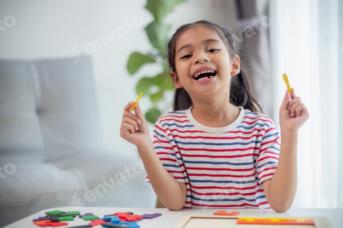 Preview: Asian girls play with puzzles, learn math, education concept
