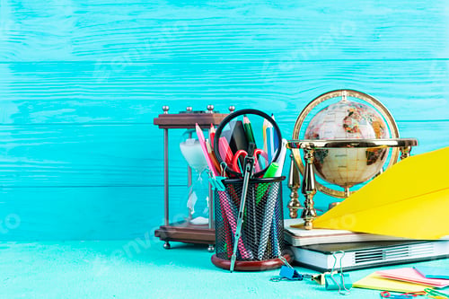Preview: Different school supplies on blue background. Concept Back to school