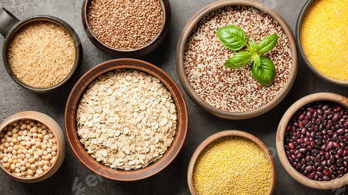 Preview: Set with various cereal grains and legumes on stone background