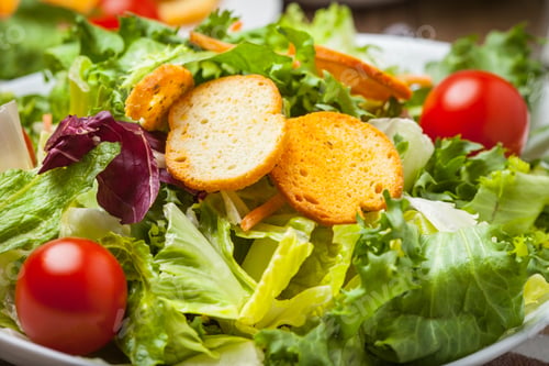 Preview: Mixed salad in white bowl.