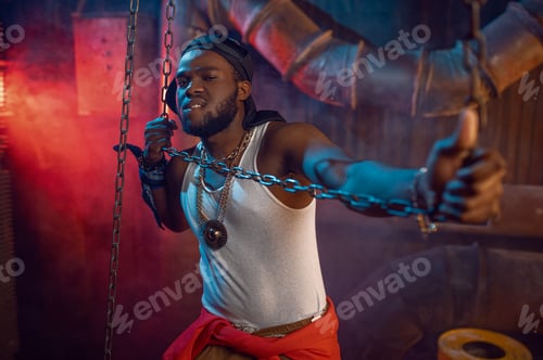 Preview: Stylish rapper poses with chains in studio