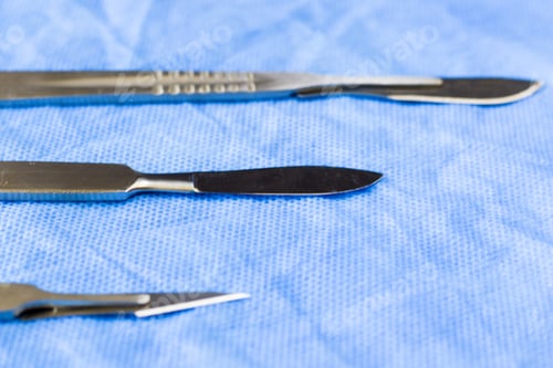 Preview: Closeup of a surgery blade on the sterile table