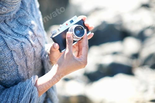 Preview: Woman holding film camera