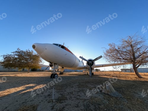 Preview: Parked airplane parked under clear blue sky