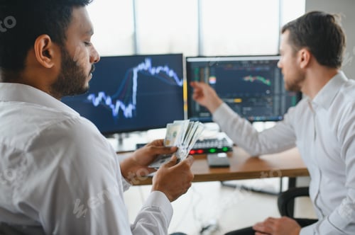 Preview: Two diverse business men analysts partners talking, working together