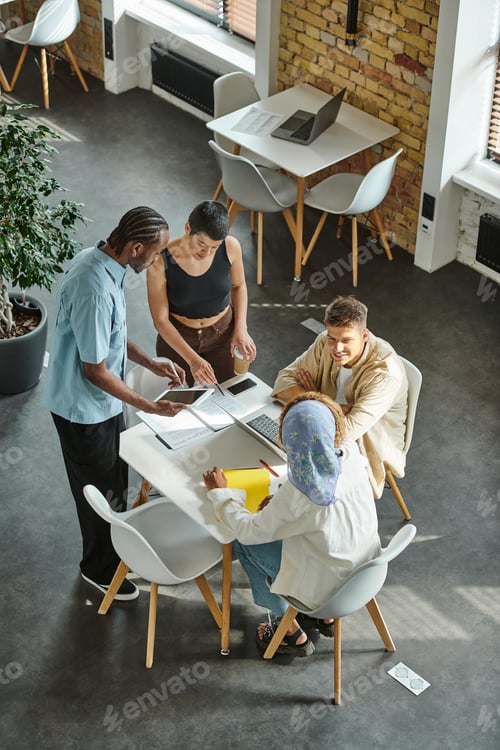 Preview: coworking life, interracial business people discussing startup project in office, generation z, work
