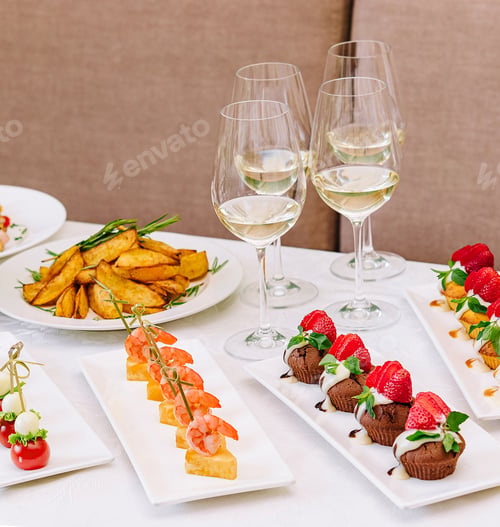 Preview: table with different gourmet snacks for white wine
