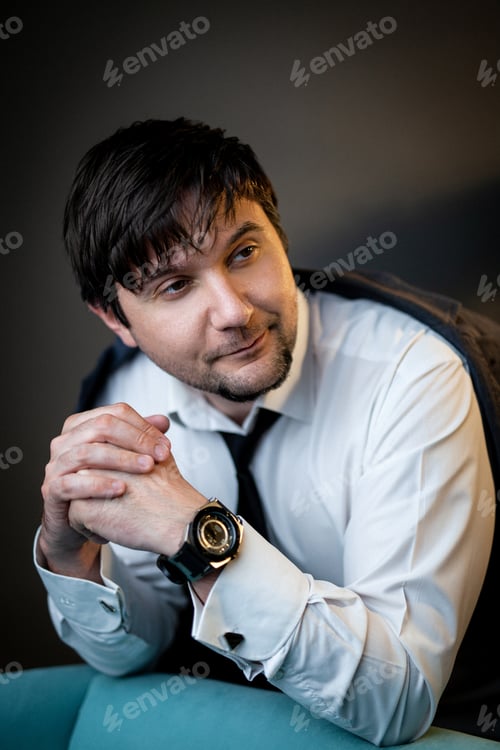 Preview: business man portrait against a dark background