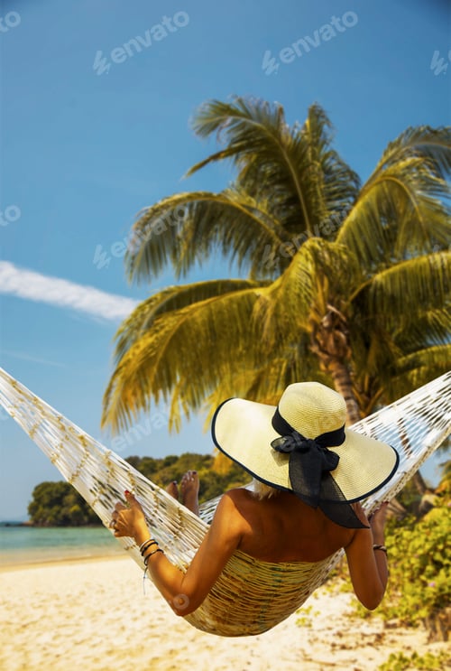 Preview: Woman relaxing at the beach