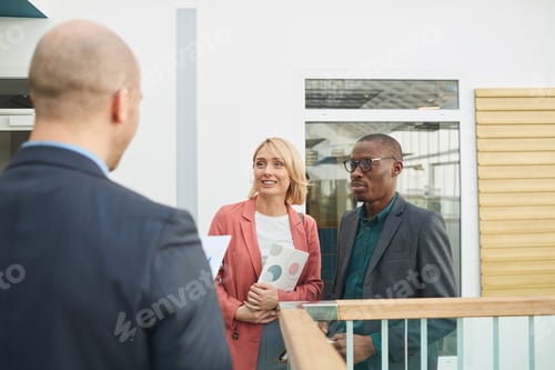Preview: Business partners meeting their colleague