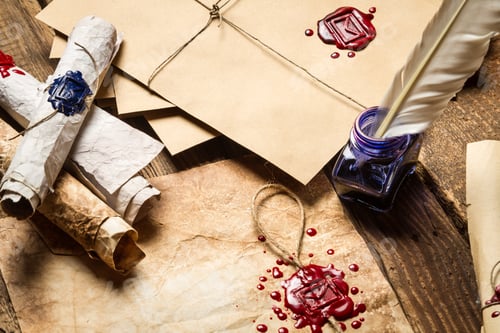 Preview: Old scrolls, sealing wax, old envelope and blue ink on wooden table