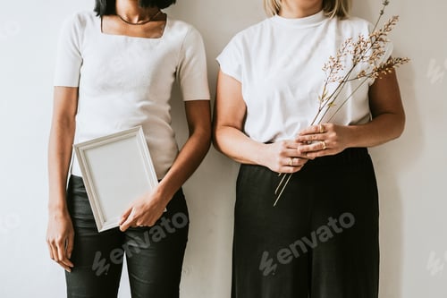 Preview: Women holding blank frame, design space