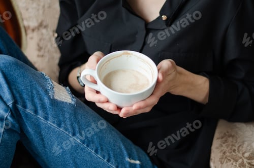 Preview: Woman with Coffee Cup Relaxing at Home