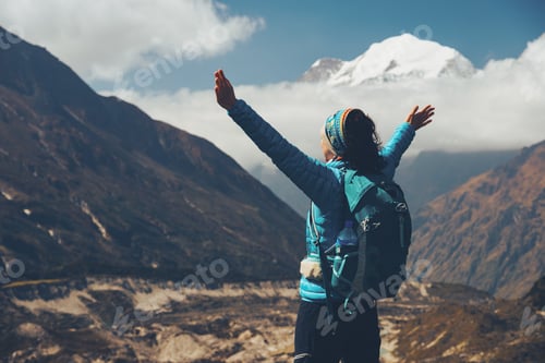 Preview: Woman with backpack and raised up arms. Vintage