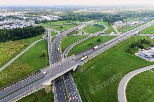 Preview: Cars moving on transport road junction in city, aerial view