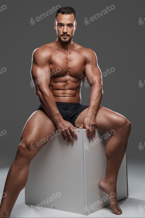 Preview: Stunningly handsome and muscular male model in black briefs