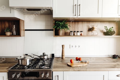 Preview: Stylish kitchen interior with modern cabinets and stainless steel appliances in new home