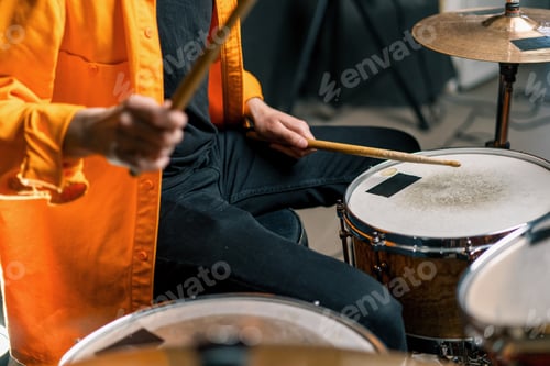 Preview: male drummer plays a drum kit in a recording studio at a professional musician's rehearsal recording