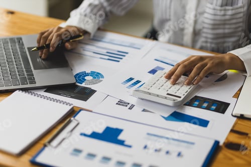 Preview: Professional investor or business finance accountant is analyzing market reports to profitability.