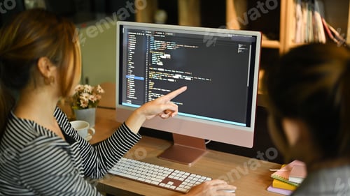 Preview: Team of software development brainstorming, working with coded data in corporate office.
