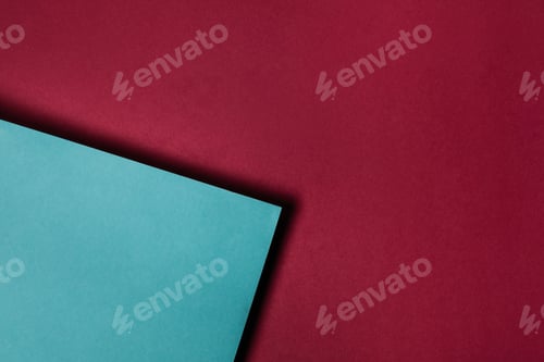 Preview: turquoise paper sheet on maroon background