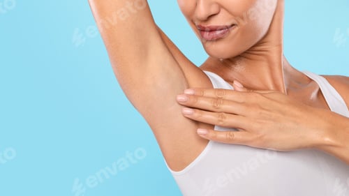 Preview: Closeup of unrecognizable young woman showing armpits