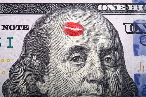 Preview: Imprint of the kiss on portrait of Benjamin Franklin on a hundred dollar bill.