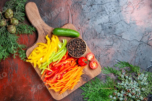 Preview: top view colorful cut peppers black pepper tomatoes cucumber on cutting board pine branches on dark