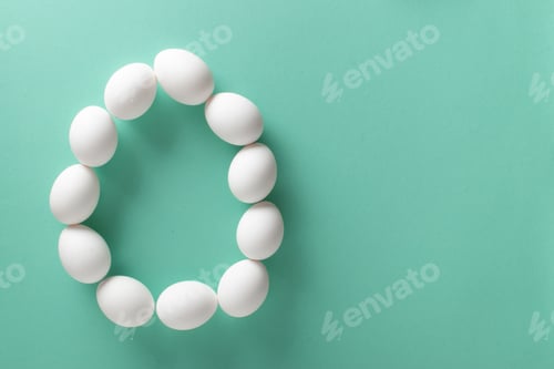 Preview: Banner with the image of a large egg made of white eggs on a light blue background.