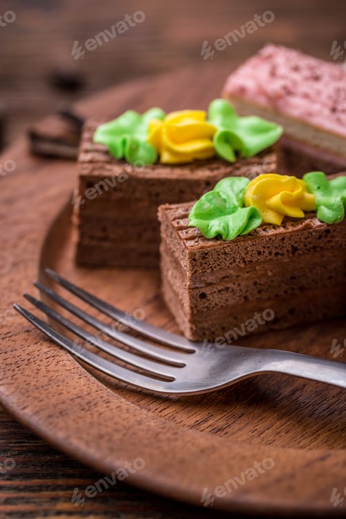Delicious Chocolate Cakes with Colorful Frosting on Tray