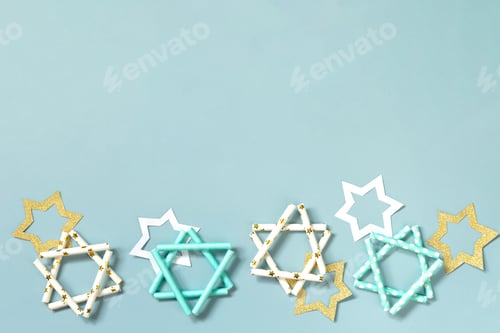 Preview: Symbol of Hanukkah star of David on a blue background.