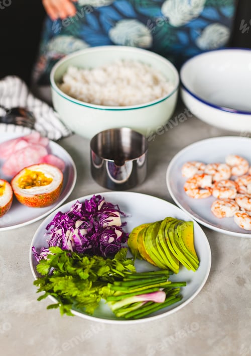 Preview: Poke bowl with shrimp prepared by the chef containing white rice, mango, avocado, tomato, etc.
