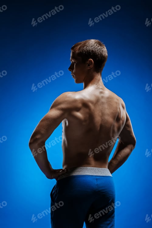 Preview: The Fit Young Man With Beautiful Torso On Blue Background