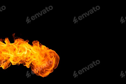 Preview: Close up of yellow and orange flames and copy space on black background
