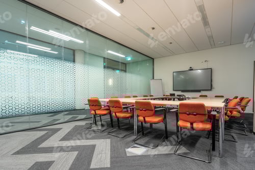 Preview: Conference room interior of a modern office with white walls and a monitor