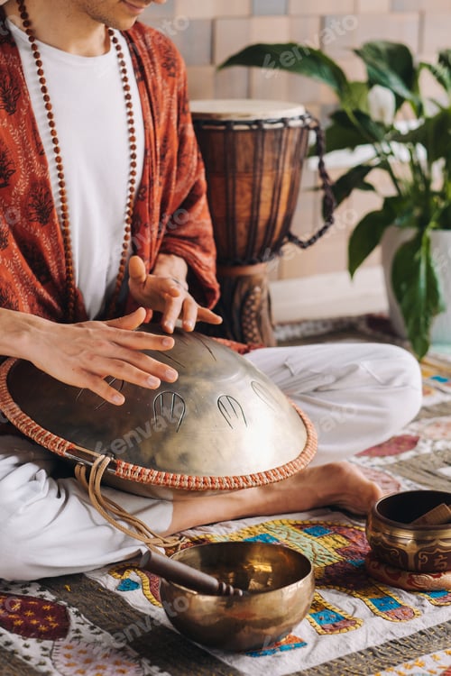 Preview: Close-up of a man's hand playing a modern musical instrument, the orion reed drum