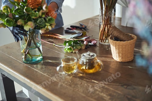 Preview: Florist creating flower bouquets in a floral shop
