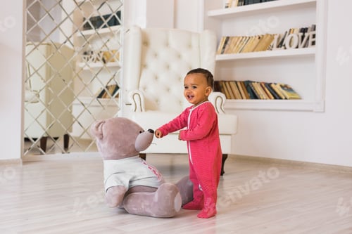 Preview: african american baby boy with teddy bear